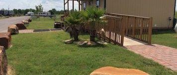 Landscaped walkway and grounds at Texas 6 RV Park Rosharon Texas